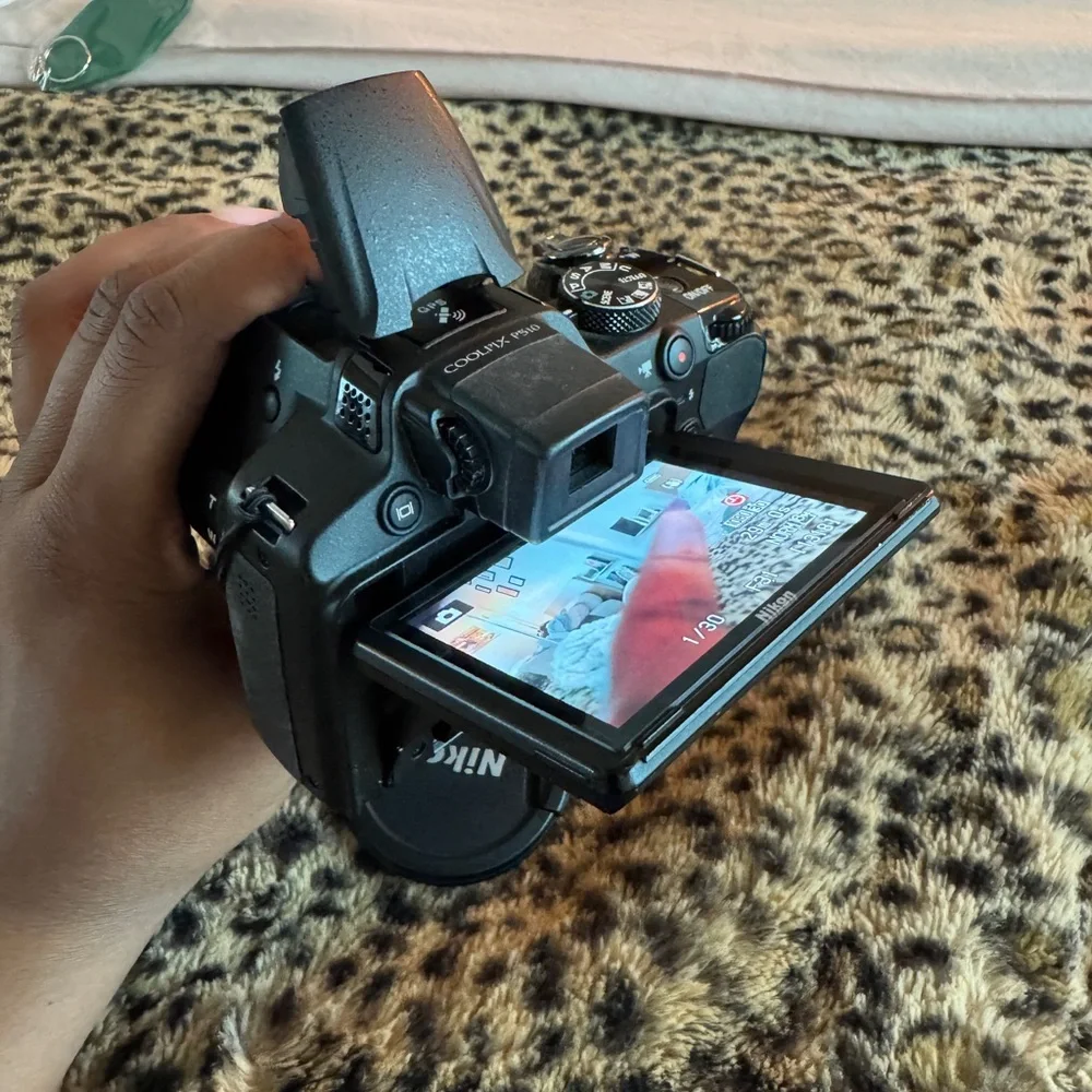 Nikon Black Camera with White Accessories
